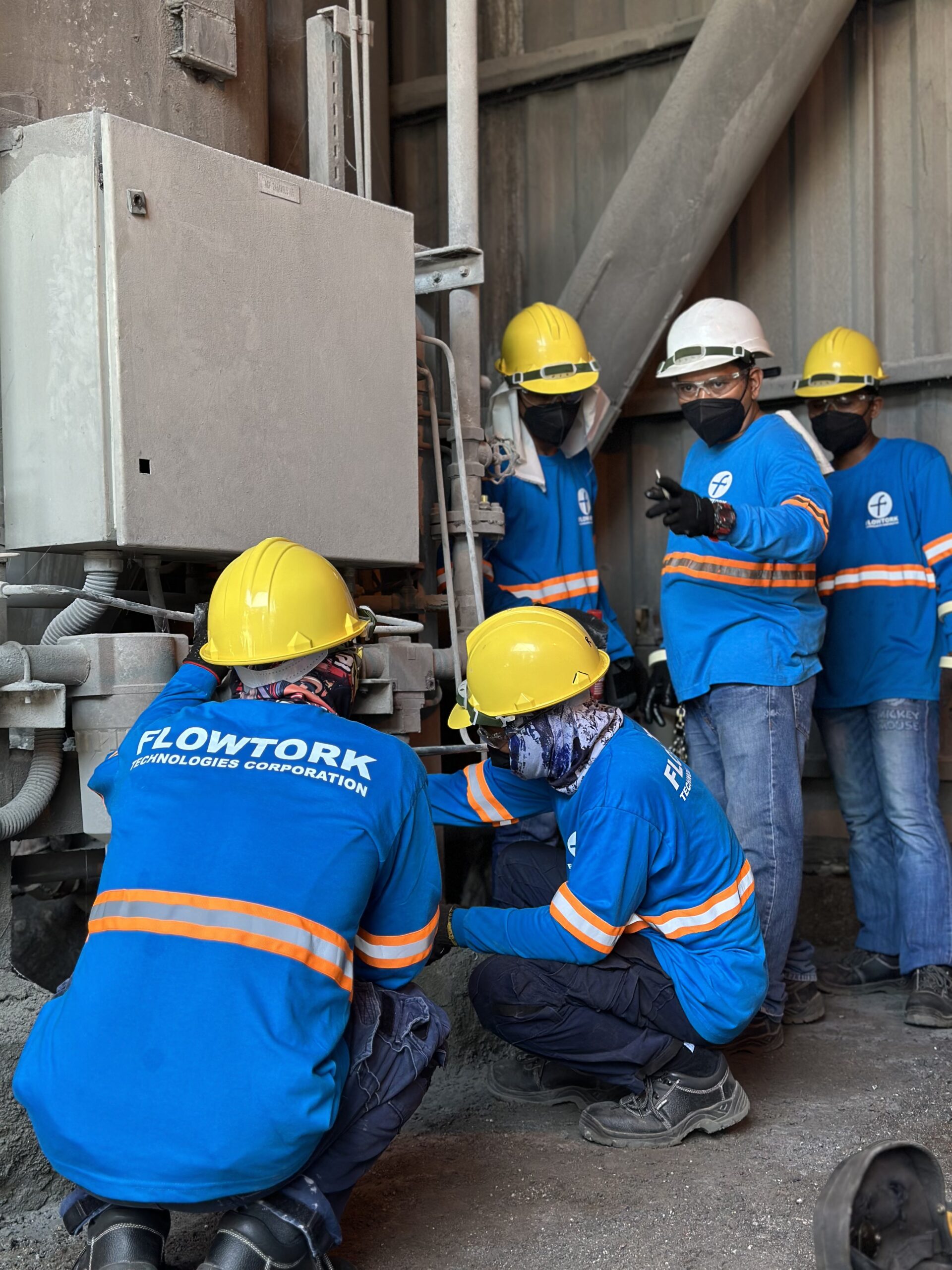 Flowtork service crew working on process equipment on site